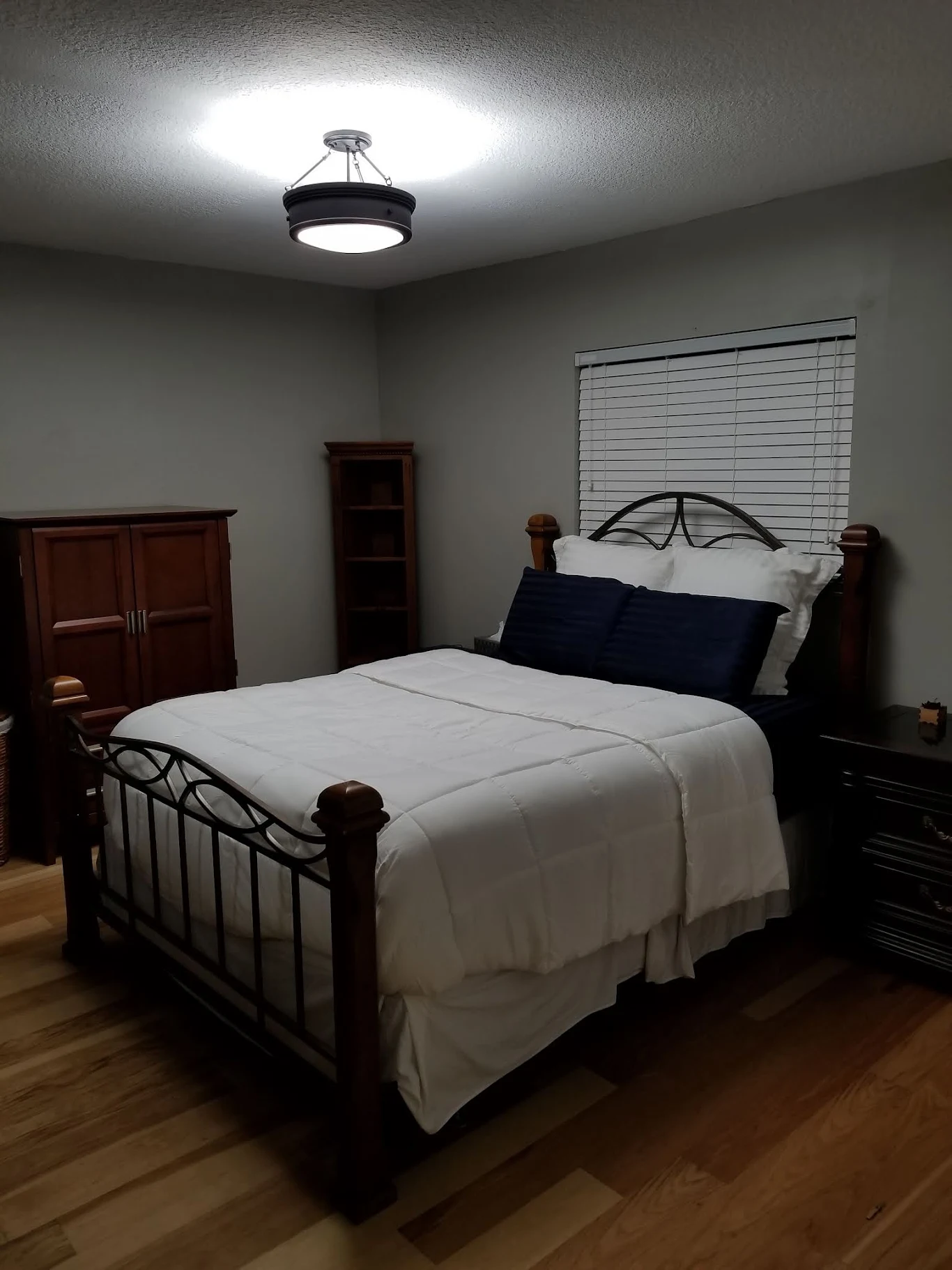 Flush-mount ceiling light installed in a bedroom